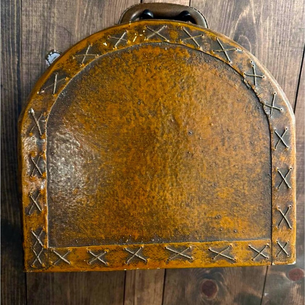 Art deco hat box. Brown leather with x stitching.